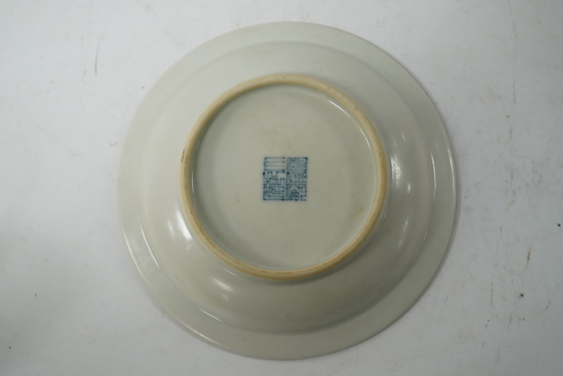 A Chinese porcelain yellow-ground tea cup and saucer, 13cm diameter. Condition - good